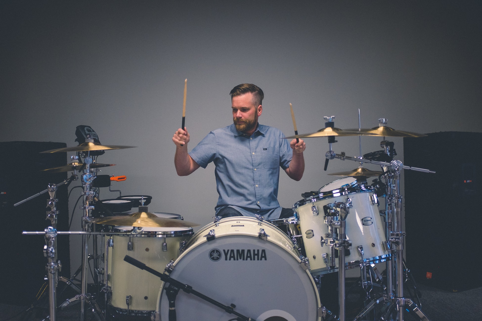 A man playing drums in the rental