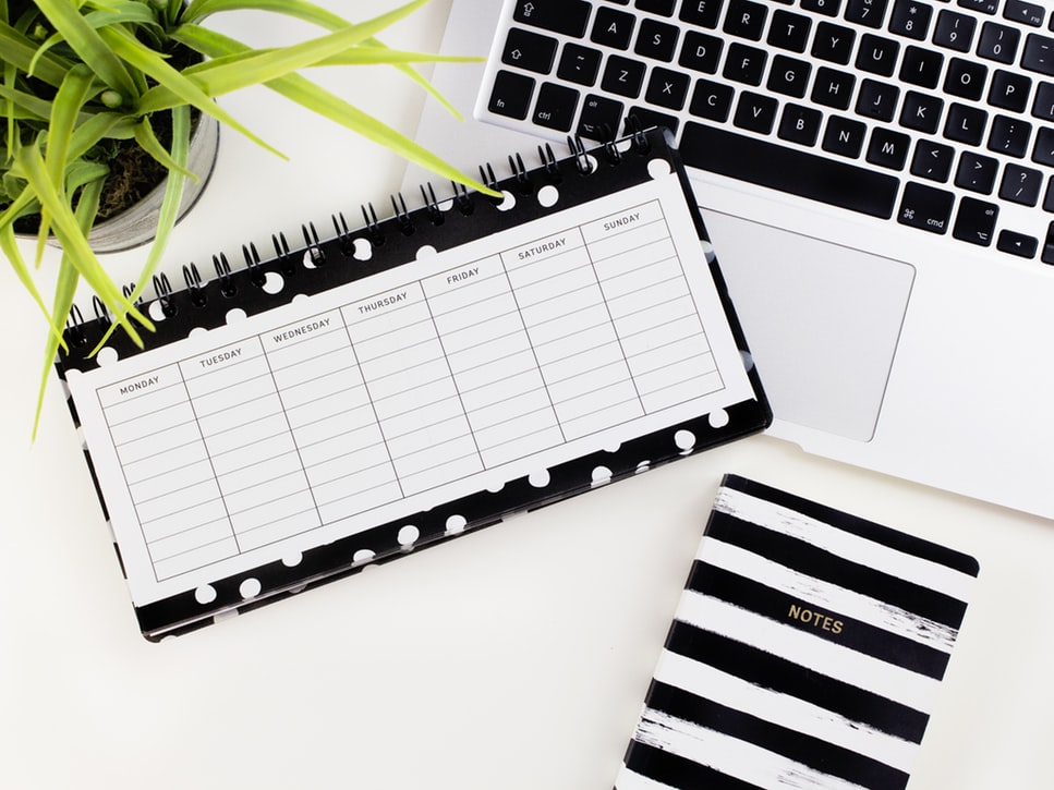 A planner and a laptop of a successful landlord